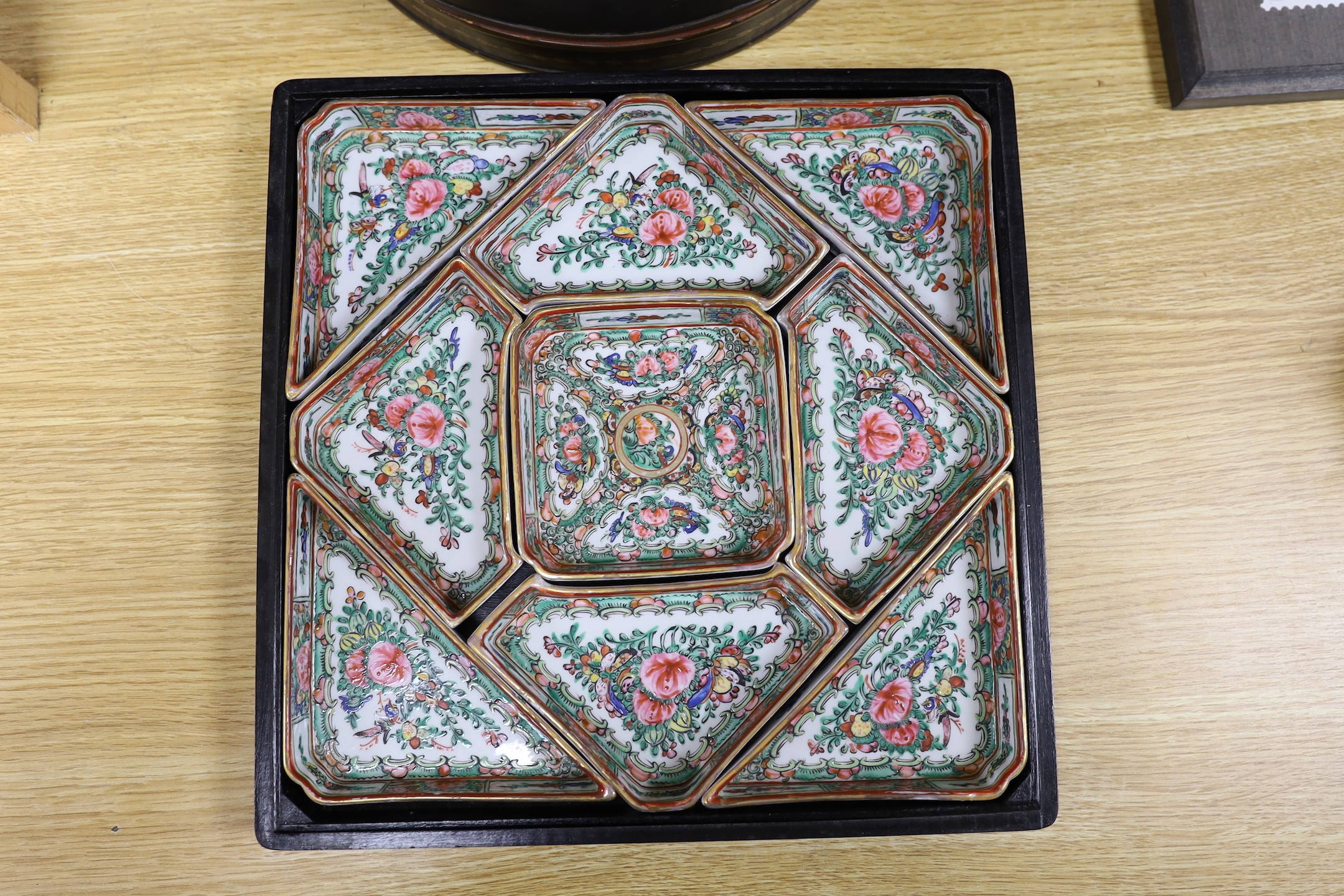 An early 20th century Chinese polychrome lacquer supper set and a Chinese Republic period famille rose boxed slipper (2 sets), slipper box, 31 cms square